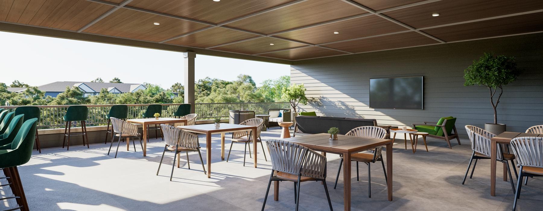 a rooftop patio with tables and chairs