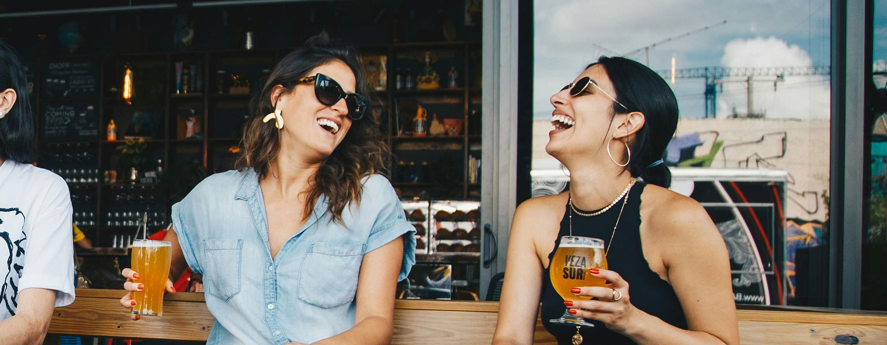 friends sharing a beer together outside